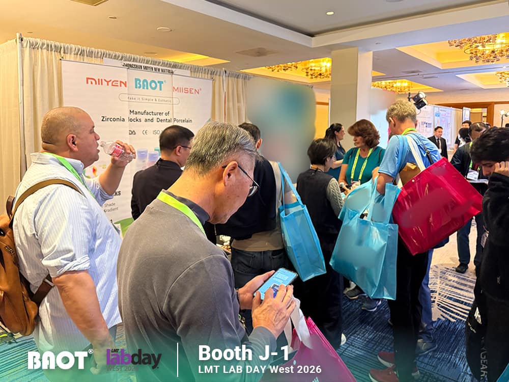 Visitors exploring BAOT dental materials at Booth J-1